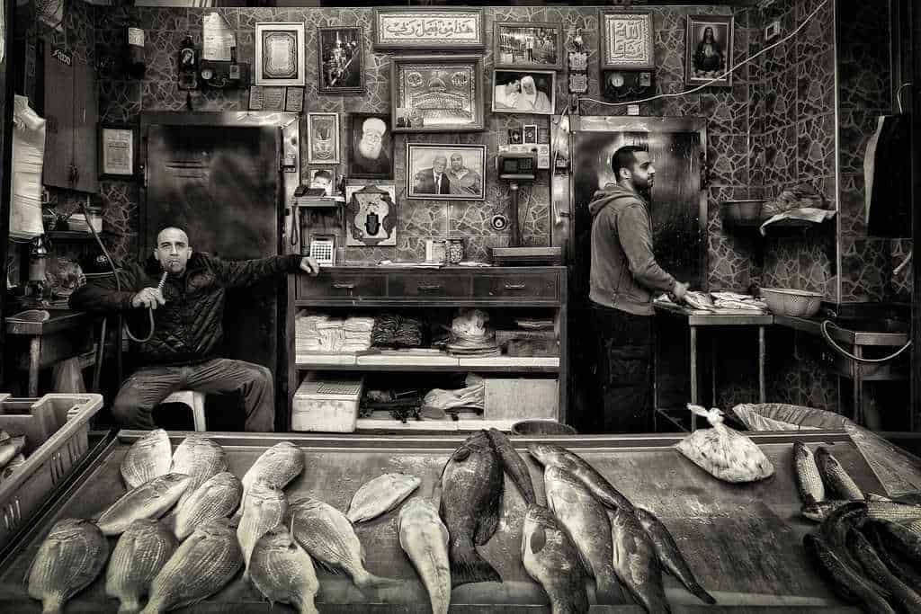 Fish merchant smoking a nargilah Award Winning Photography