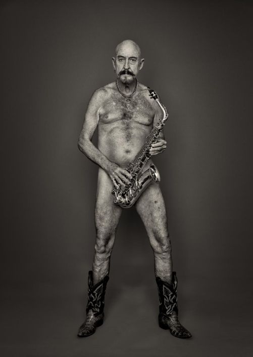 Nude Man holding a saxophone